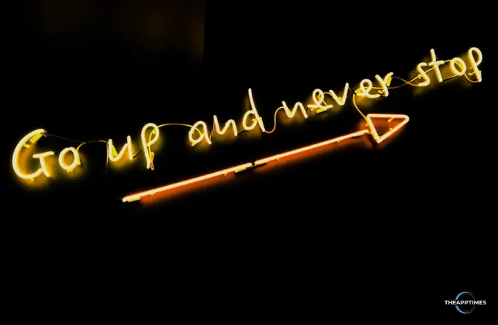 A neon sign that says "Go up and never stop" with an arrow pointing to the side and up representing the success to be had when using bottom of the funnel marketing.